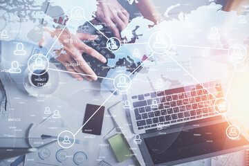 Double exposure of man and woman working together and social network theme hologram drawing. Computer background. connecting concept. Top View.