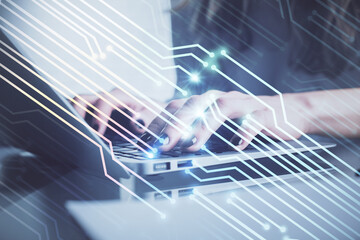 Double exposure of woman hands working on computer and data theme hologram drawing. Tech concept.