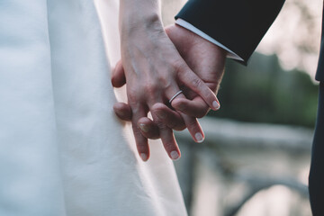 Couple holding hands after getting married