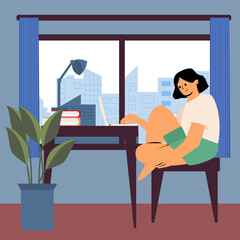 The girl works from home. Freelancer, remote worker, student. A woman is sitting in a room by the window