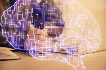 Double exposure of woman on-line shopping holding a credit card and brain hologram drawing. Data E-commerce concept.