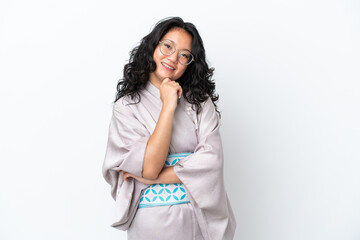 Young asian woman wearing kimono isolated on white background with glasses and smiling