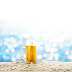 Glass of cold beer and beach landscape 