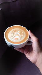 person holding a cup of coffee