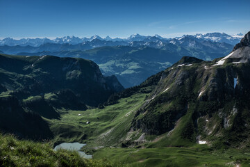 Landscape view of the swiss Alps, with blue sky in the background, shot from the "Kaiseregg" mountain, near Schwarzsee,Fribourg, Switzerland