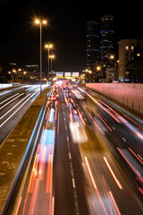 Fototapeta na wymiar continuous light of car traffic at night city