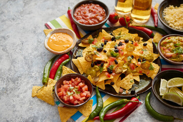 Mexican nachos tortilla chips with black bean, jalapeno, guacamole