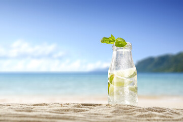 Bottle of drink and beach landscape 