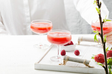 Fresh summer cocktail with strawberry on white background.