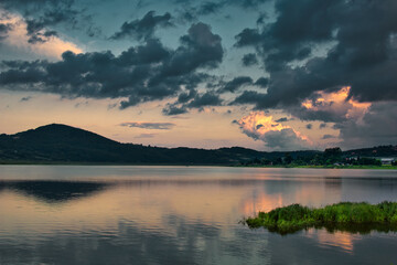 Lake sunset landscape. Sunset sky. Cloudy sunset. Lake sunset. Sky reflection. Sky reflection in the water. Water reflection