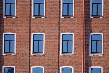 A fragment of the facade of an old building on a summer evening