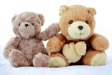 Romantic and delight atmosphere in bedroom set by concept of two brown lovely fluffy teddy bear toys creatively placed nearby as sweet friend acting funny play