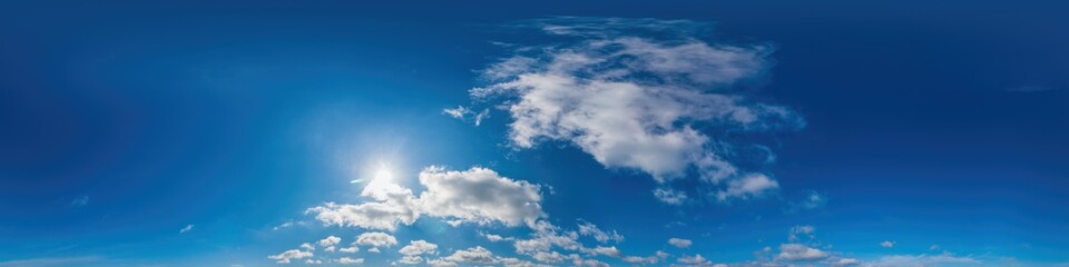 Obraz premium Blue sky panorama with Cirrus clouds in Seamless spherical equirectangular format. Full zenith for use in 3D graphics, game and editing aerial drone 360 degree panoramas for sky replacement.