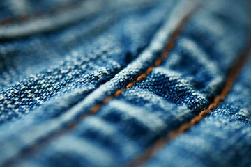 Jeans denim texture close up , focus only one point , soft blured background wallpaper