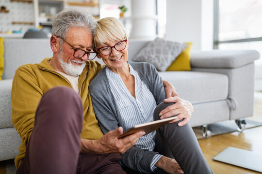 Senior Couple Doing Video Chat With Grandchildren Using Computer