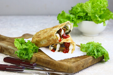 Kebab on wooden chopping board. White bright food photography.