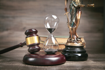  Statue of Lady Justice, hourglass, book and gavel.