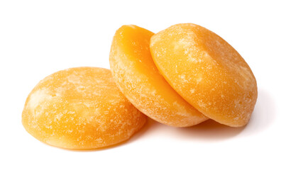 three cakes of palm sugar isolated on white background