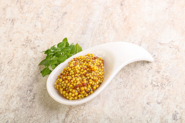 Grain mustard sauce in the bowl