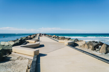 The seaway promenade with seats near the ocean on the Gold Coast