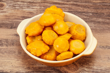 Marinated yellow patisson in the bowl