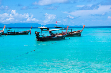 Obraz premium Anchored longtail taxi long tail boat,lipe island