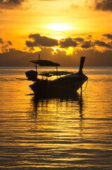 Longtail boat on the sea at sunrise in Adang-Ravi Islandsin,Tarutao National Park, Satun Thailand.