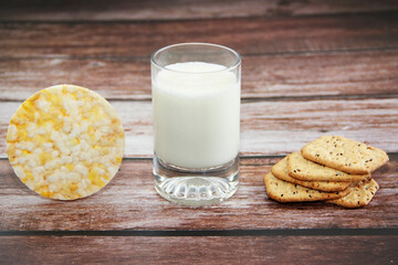 white kefir in a glass and crunchy diet crackers