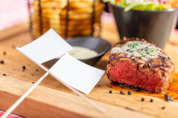 Beef steak meal and empty toothpick flags in resturant