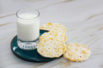 white kefir in a glass and crunchy diet crackers