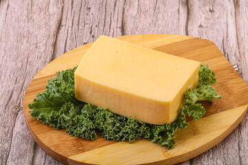 Tasty yelloow Tilsiter cheese brick