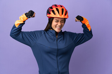 Teenager cyclist girl doing strong gesture - obrazy, fototapety, plakaty