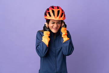 Teenager cyclist girl frustrated and covering ears