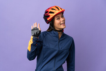 Teenager cyclist girl saluting with hand with happy expression - obrazy, fototapety, plakaty