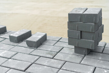 New paving slabs in rows in summer close-up. Laying of paving slabs