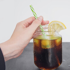 summer refreshing cola drink with lemon