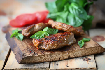 Selective focus. Appetizing juicy grilled steak. Close-up.