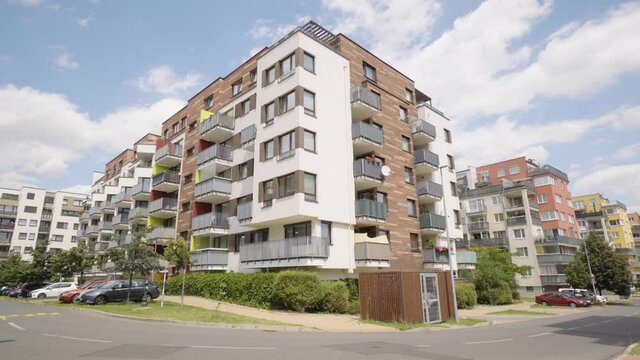 An apartment building in a suburban apartment complex - a road in the foreground