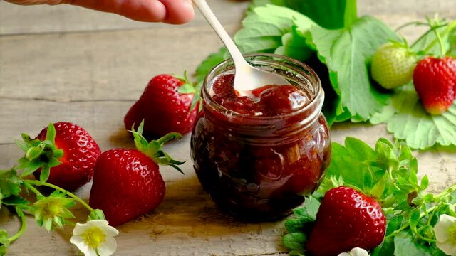Strawberry jam in a jar. Selective focus.