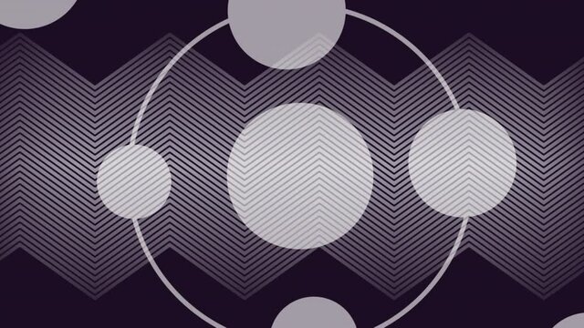 Animation of concentric rings of spheres over grey kinetic parallel zigzag lines moving on black