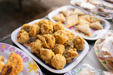 various kinds of food, fried tahu walik on a serving plate on the table
