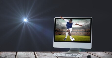 Composition of male football player kicking ball at stadium in computer