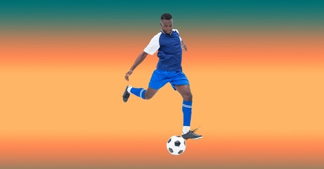 Composition of male football player kicking football with copy space