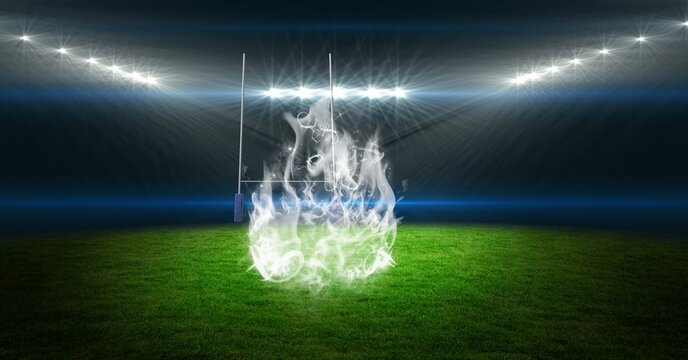 Composition of empty rugby stadium with lights and white flames