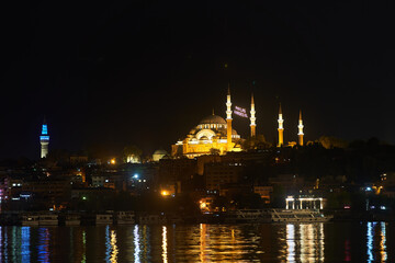 Night view across the Bosphorus to the Suleymaniye Mosque. Istanbul, Turkey. High quality 4k footage