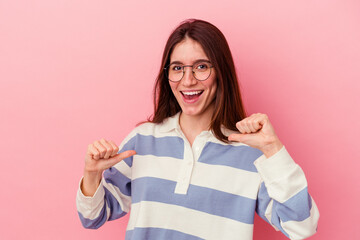 surprised pointing with finger, smiling broadly.