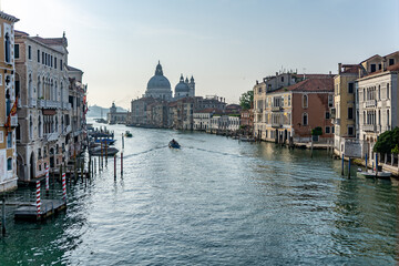 View of the Grand Canal with close up of Santa Maria della Salute, famous Roman Catholic cathedral, seen from Ponte Dell'Accademia