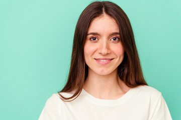 Fototapeta premium Young caucasian woman isolated on blue background