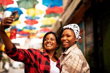 Portrait of a happy smiling female friends. Women taking selfie photo