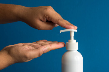 Closeup of person washing hands or using a sanitizing gel. Cleanliness and body care concept.
